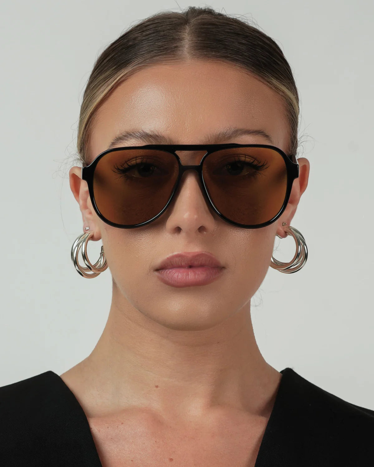 black aviator sunglasses with green lenses
