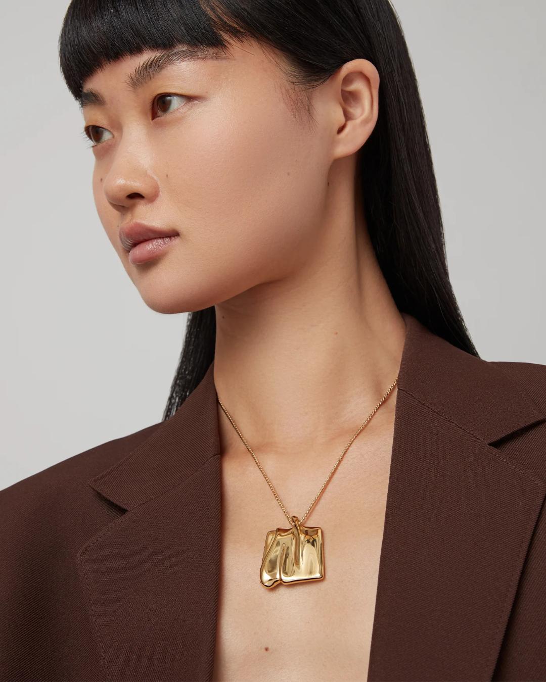 large pendant necklace in gold