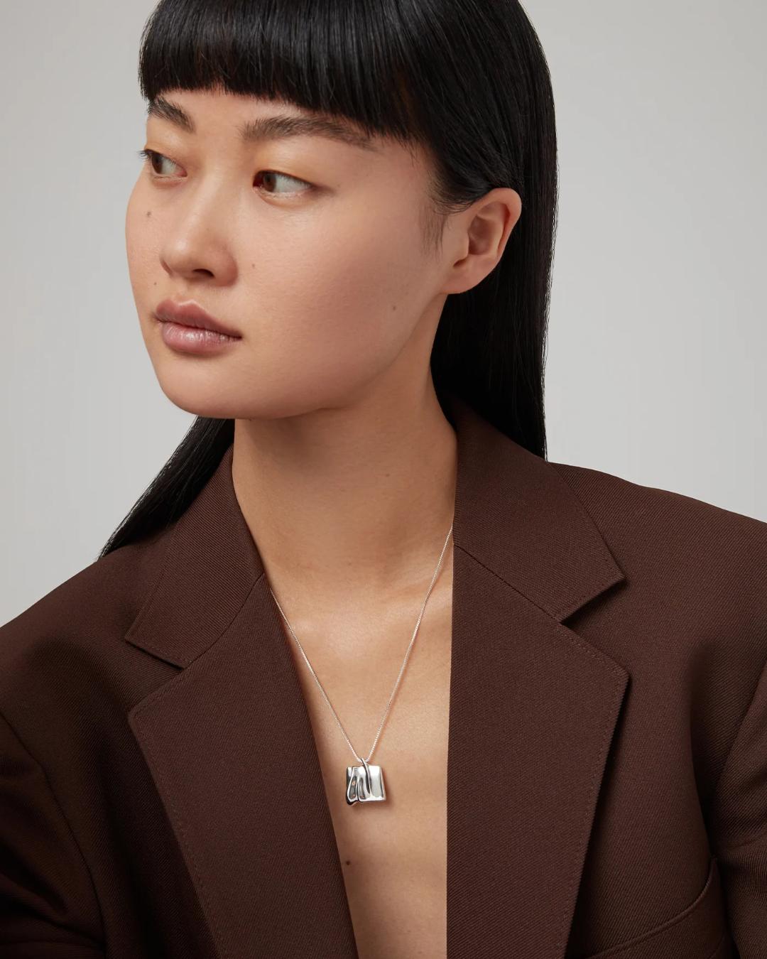 silver necklace with a silver square pendant