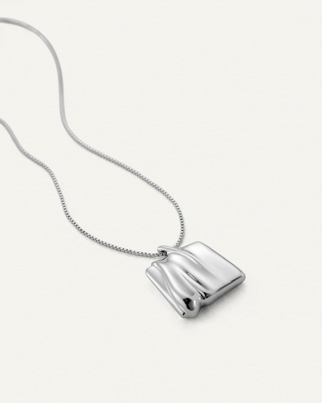 silver necklace with a silver square pendant