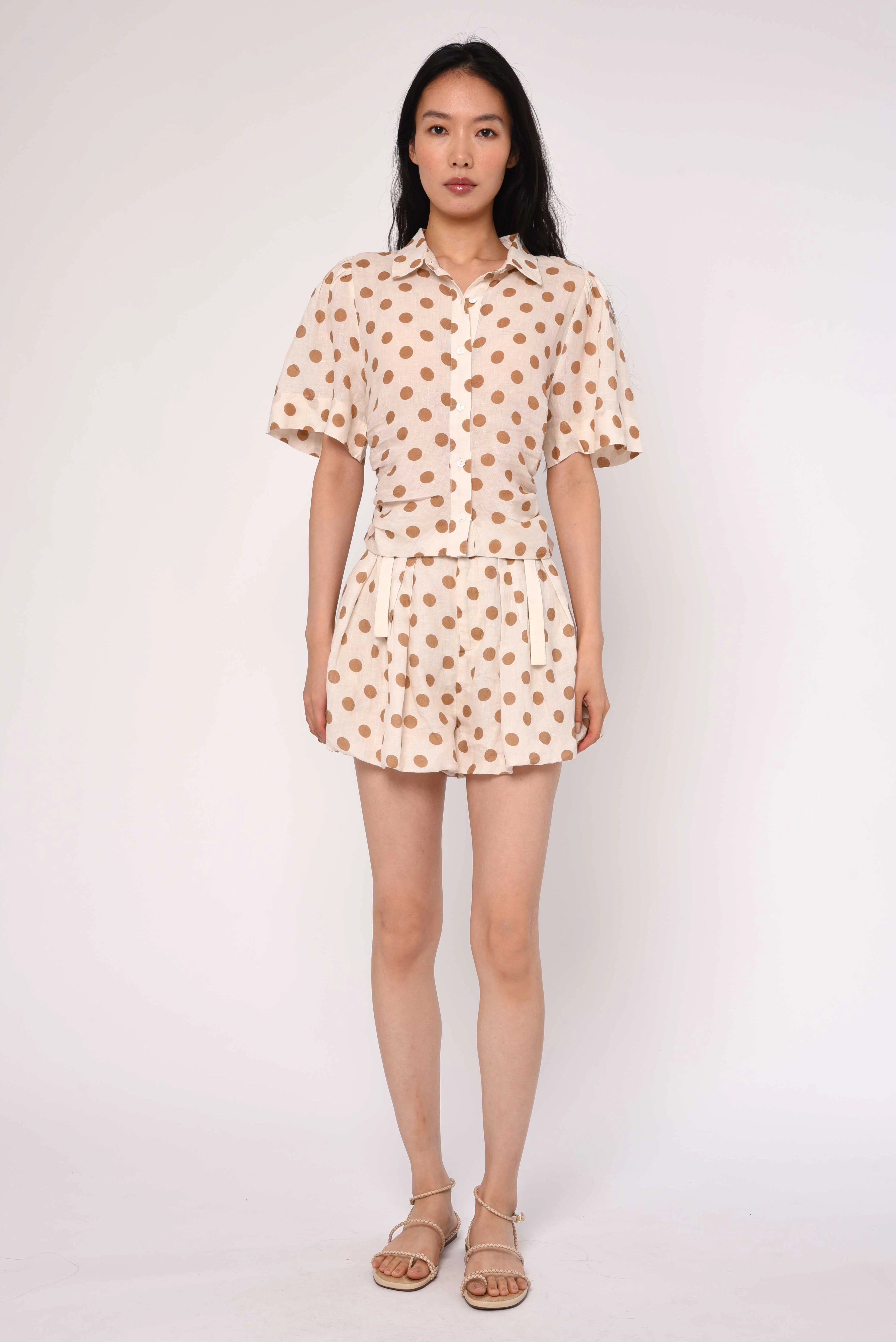 cream blouse with brown polka dots
