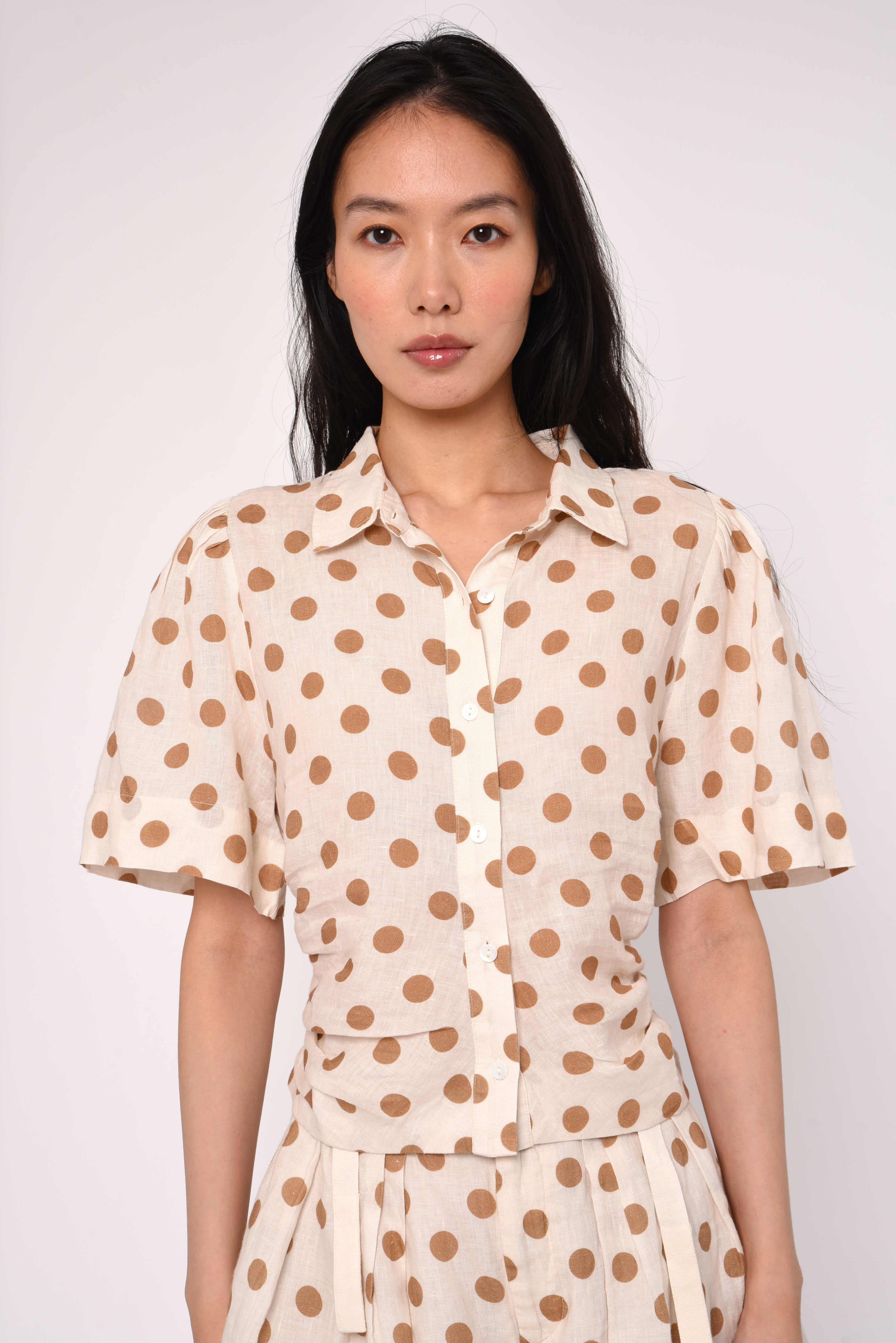 cream blouse with brown polka dots