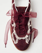 Maroon sneakers with crochet lace in white and rubber soles and ribbon laces