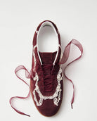 Maroon sneakers with crochet lace in white and rubber soles and ribbon laces