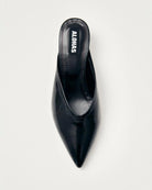 black leather mules with a pointed toe with 'Alohas' logo on them