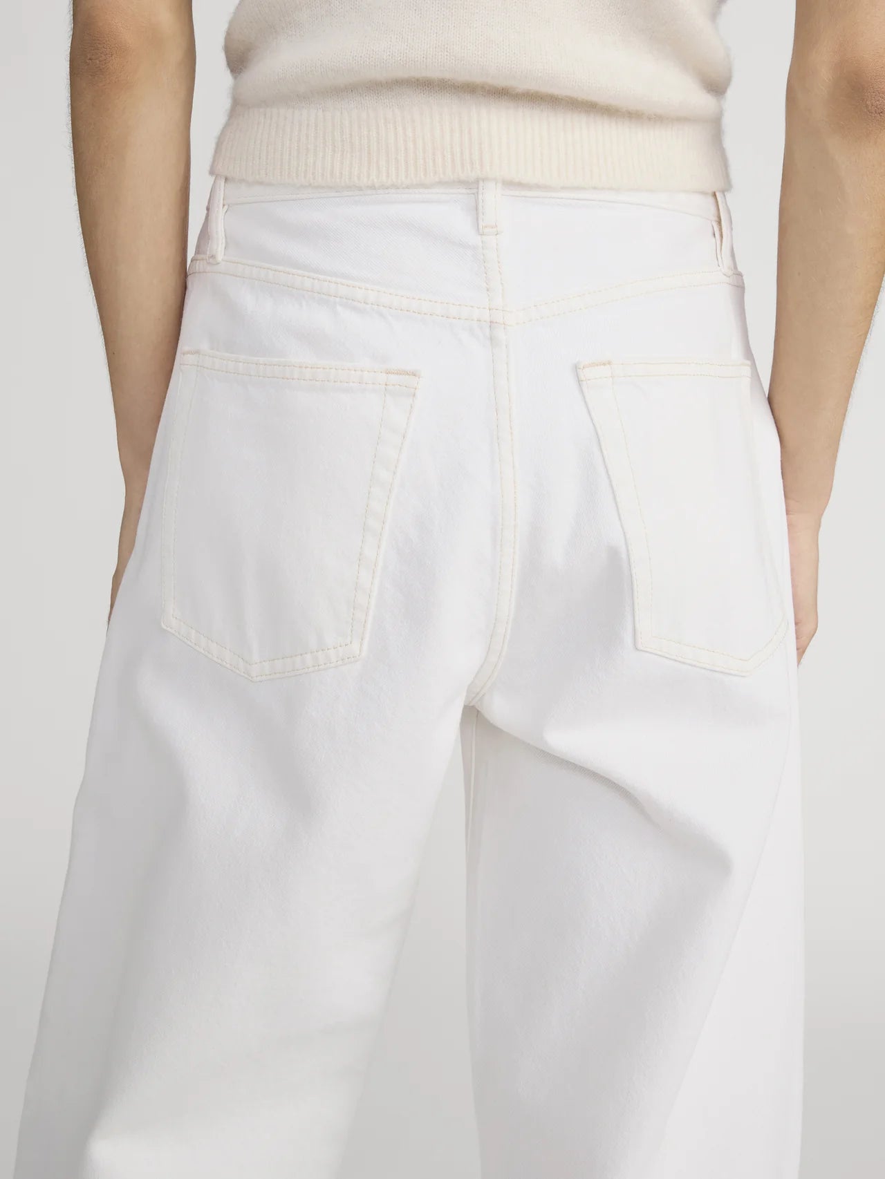 white denim pant with a bubble or curve leg