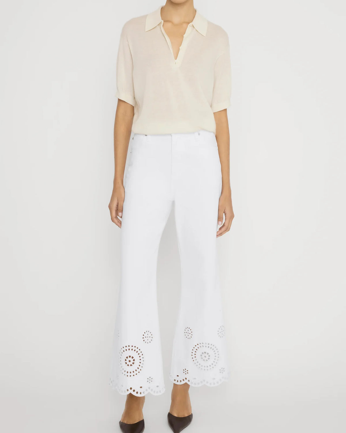 wide leg white denim pant with eyelet detail at the bottom