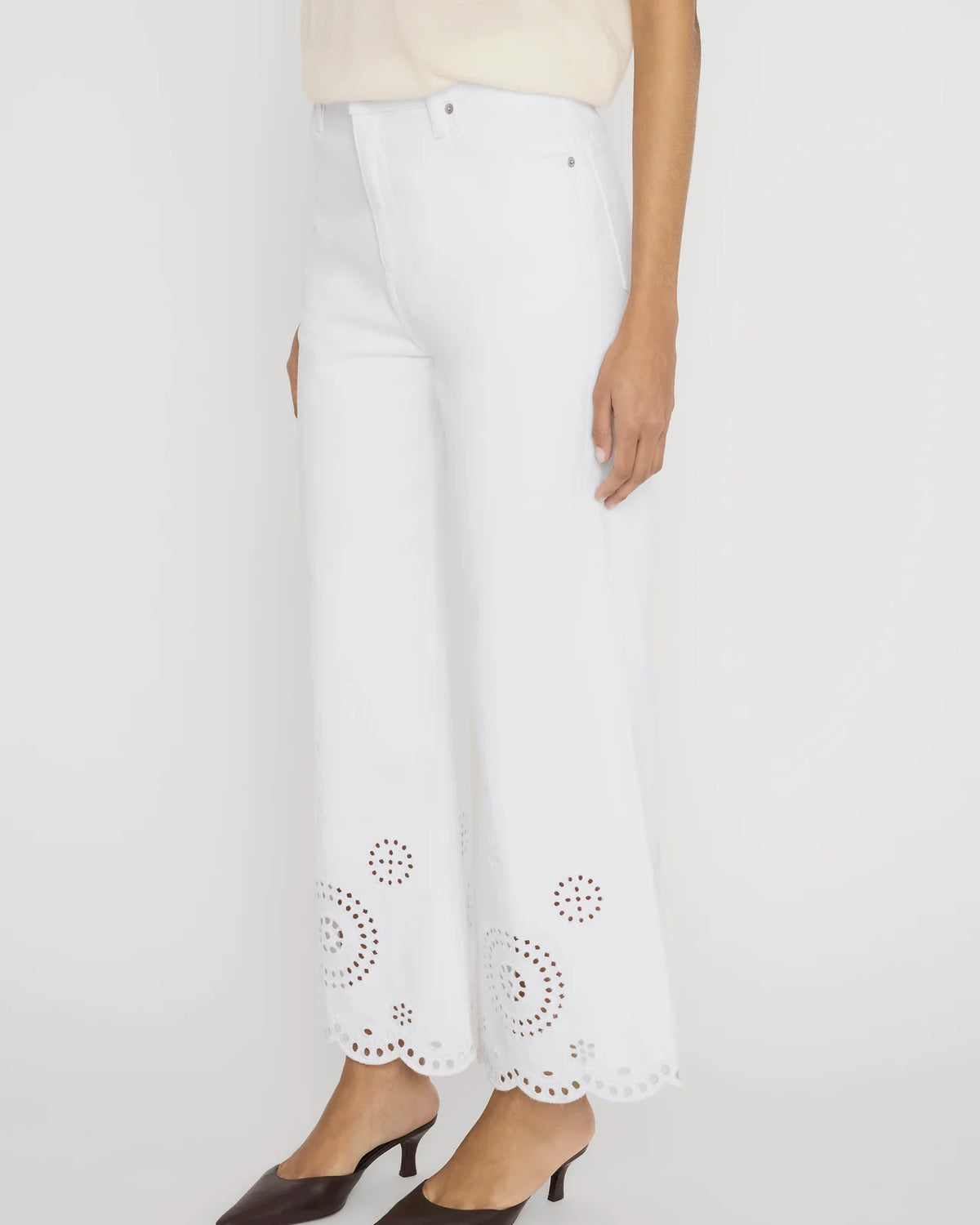 wide leg white denim pant with eyelet detail at the bottom