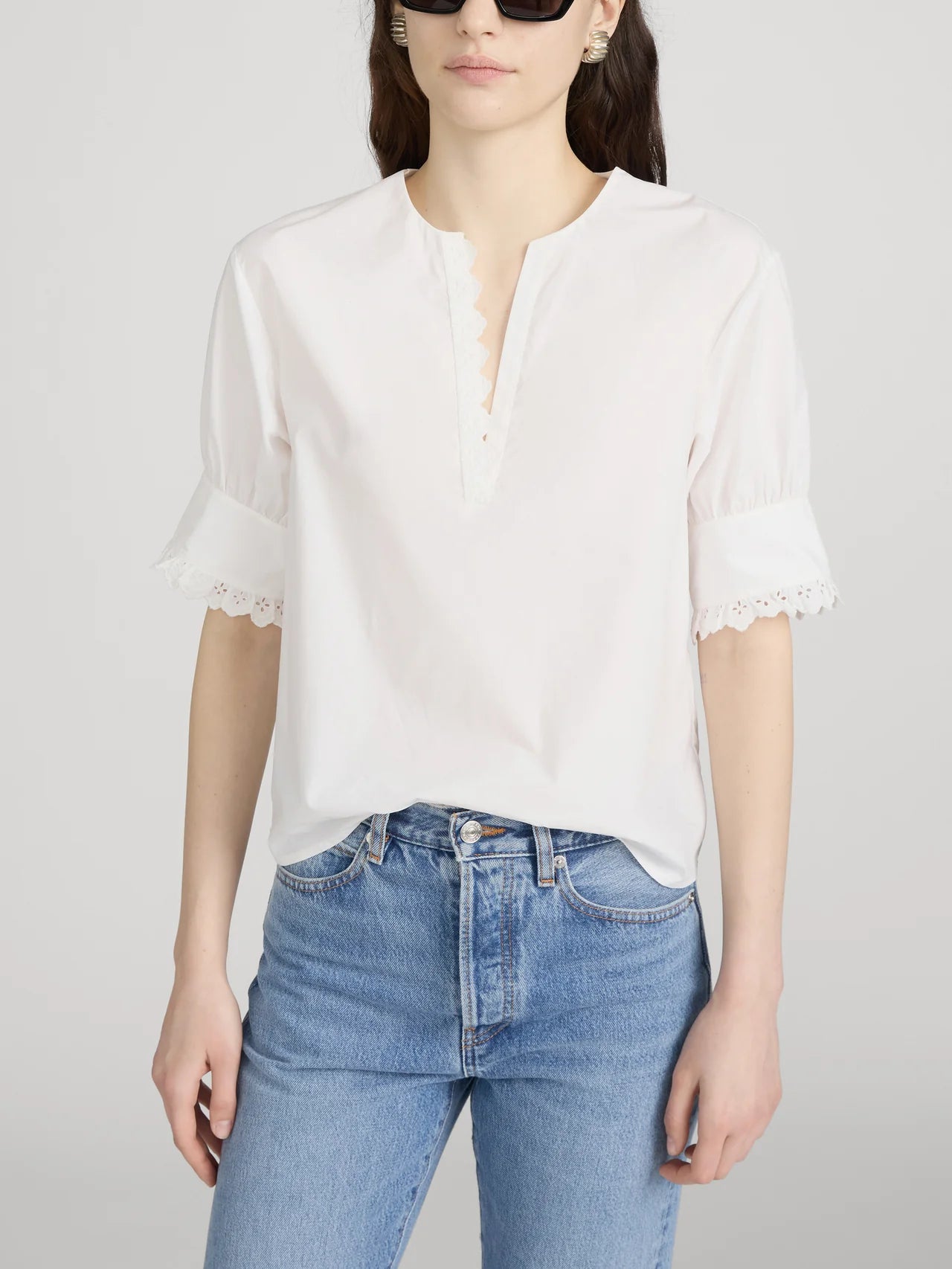 white short sleeve blouse with detail on the sleeves
