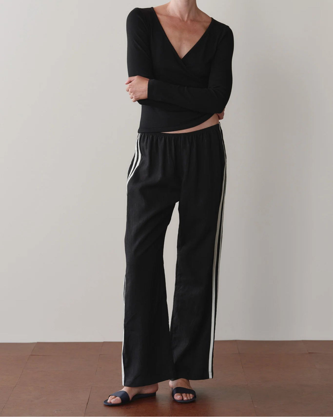 black crop pant with white stripe down the sides