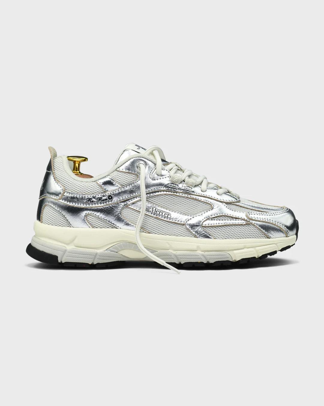 white running shoe with silvers accents