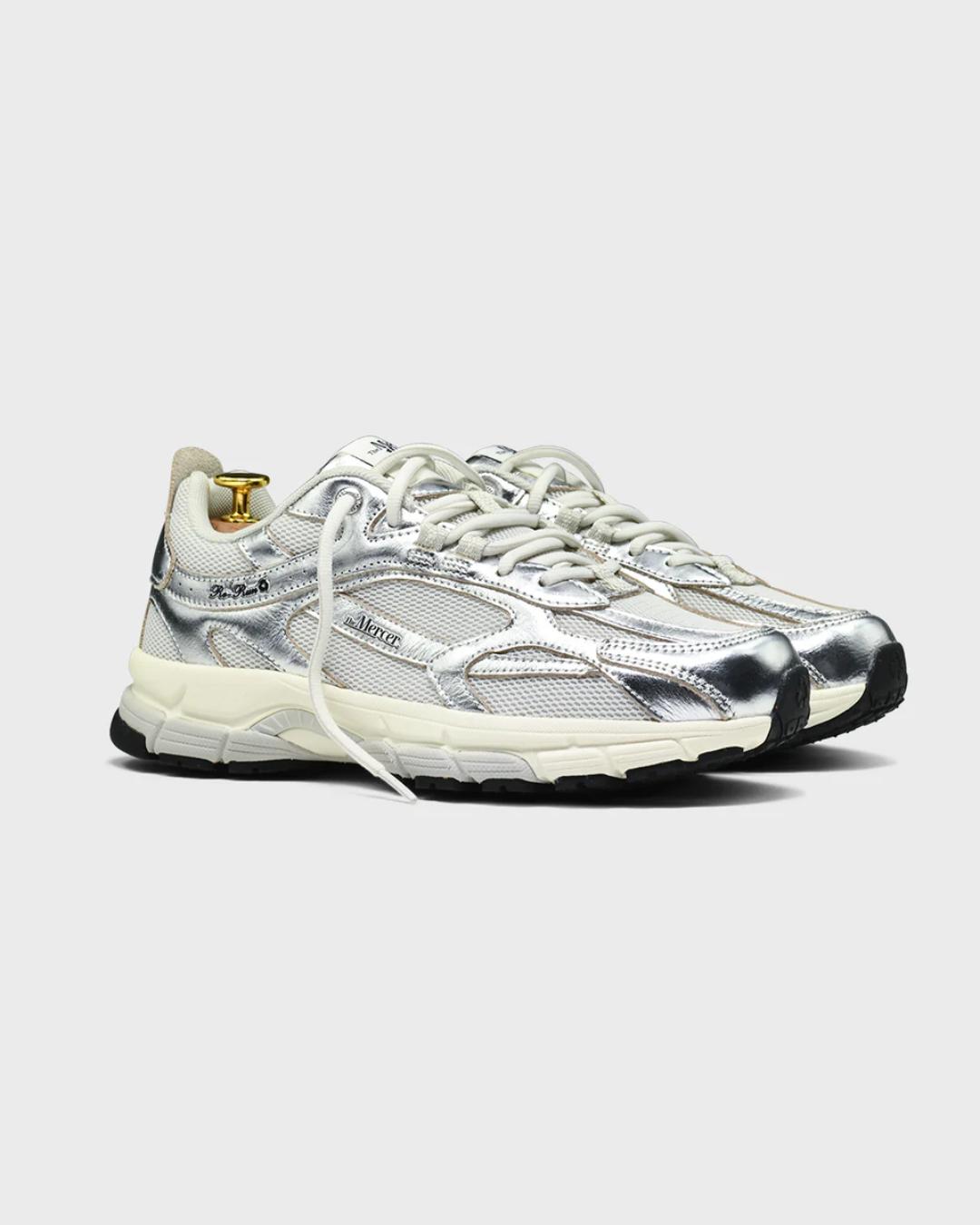 white running shoe with silvers accents