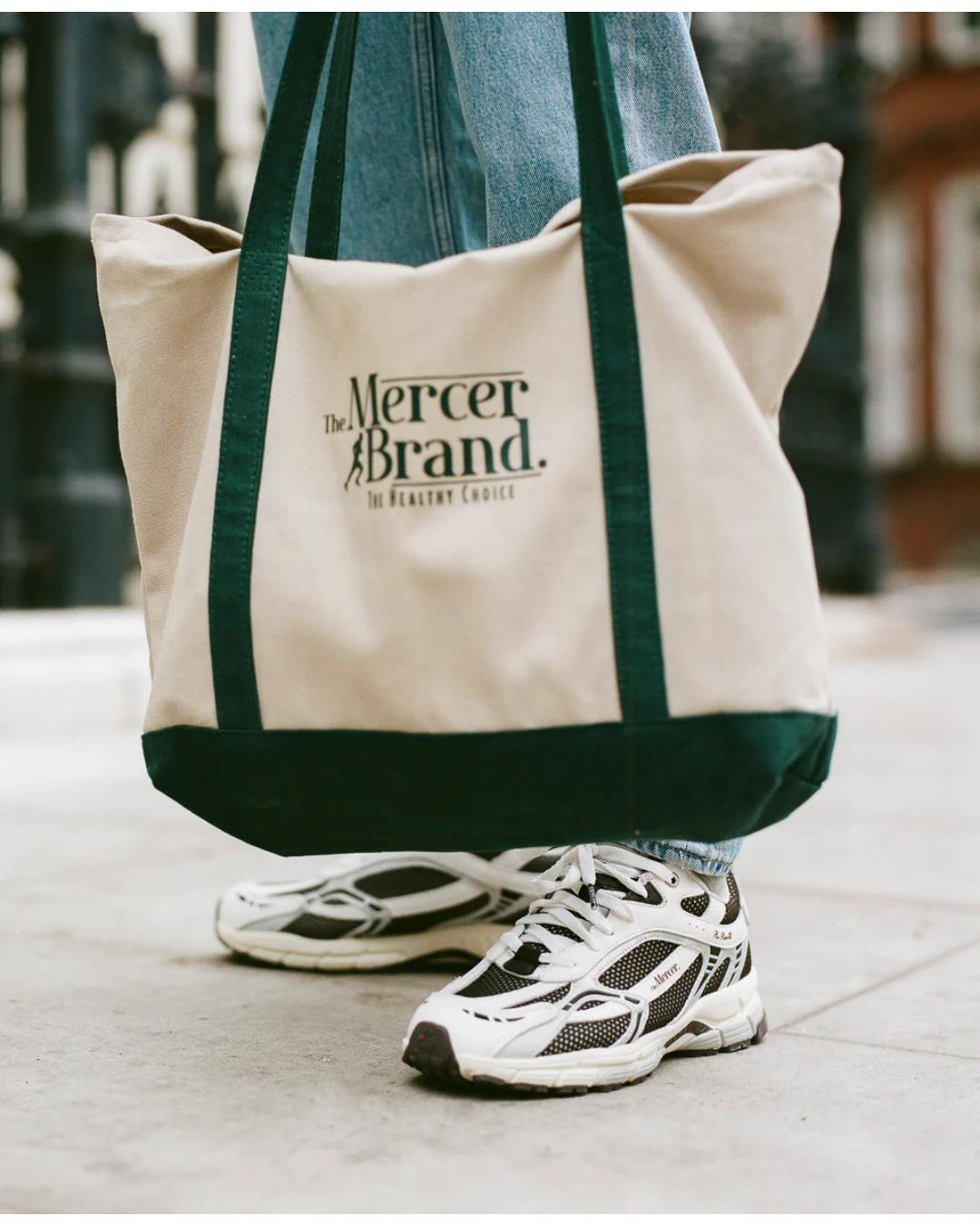 white and dark brown running shoe