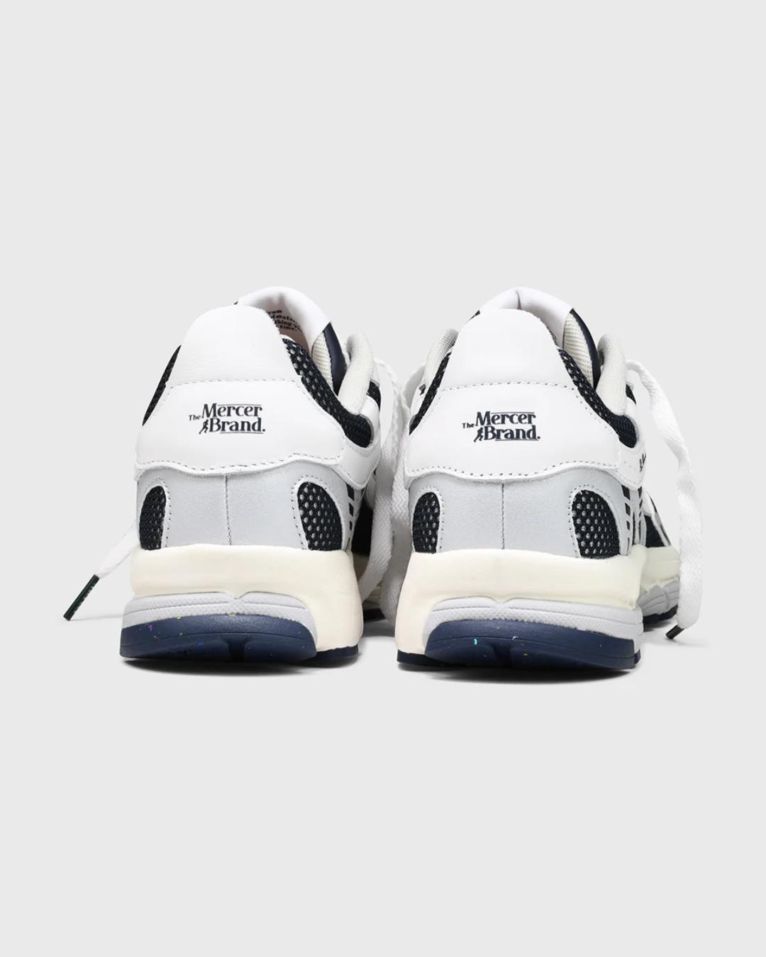 white and navy sneakers