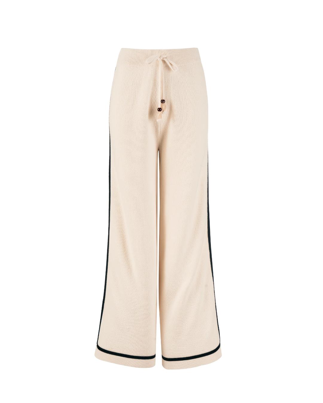 wide leg knit pant in beige and has a black stripe on the sides
