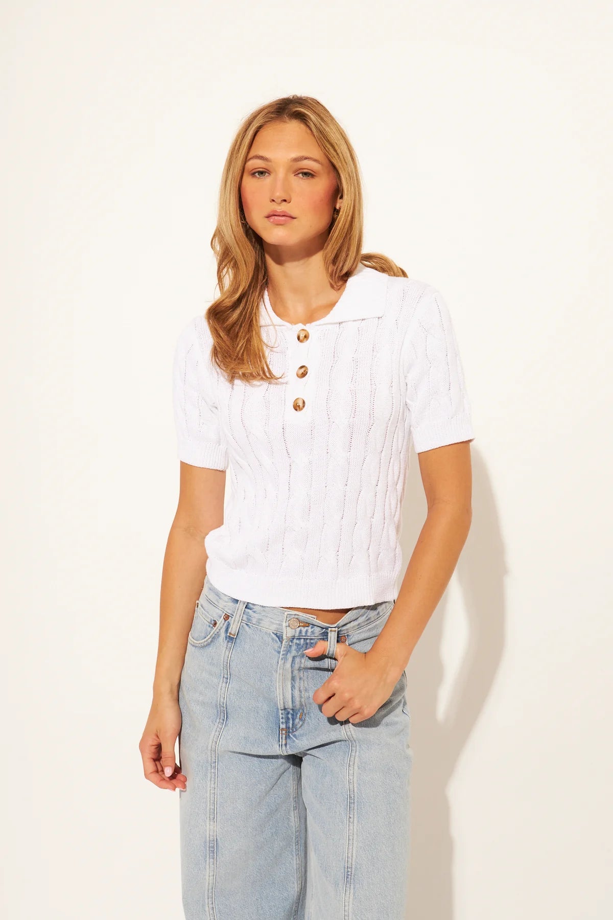 white cable knit short sleeve top with collar and three buttons