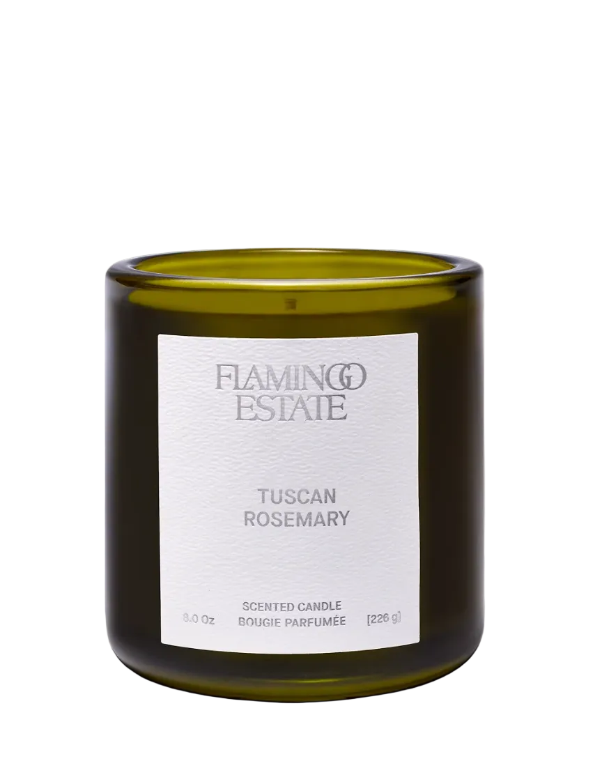candle in green glass container