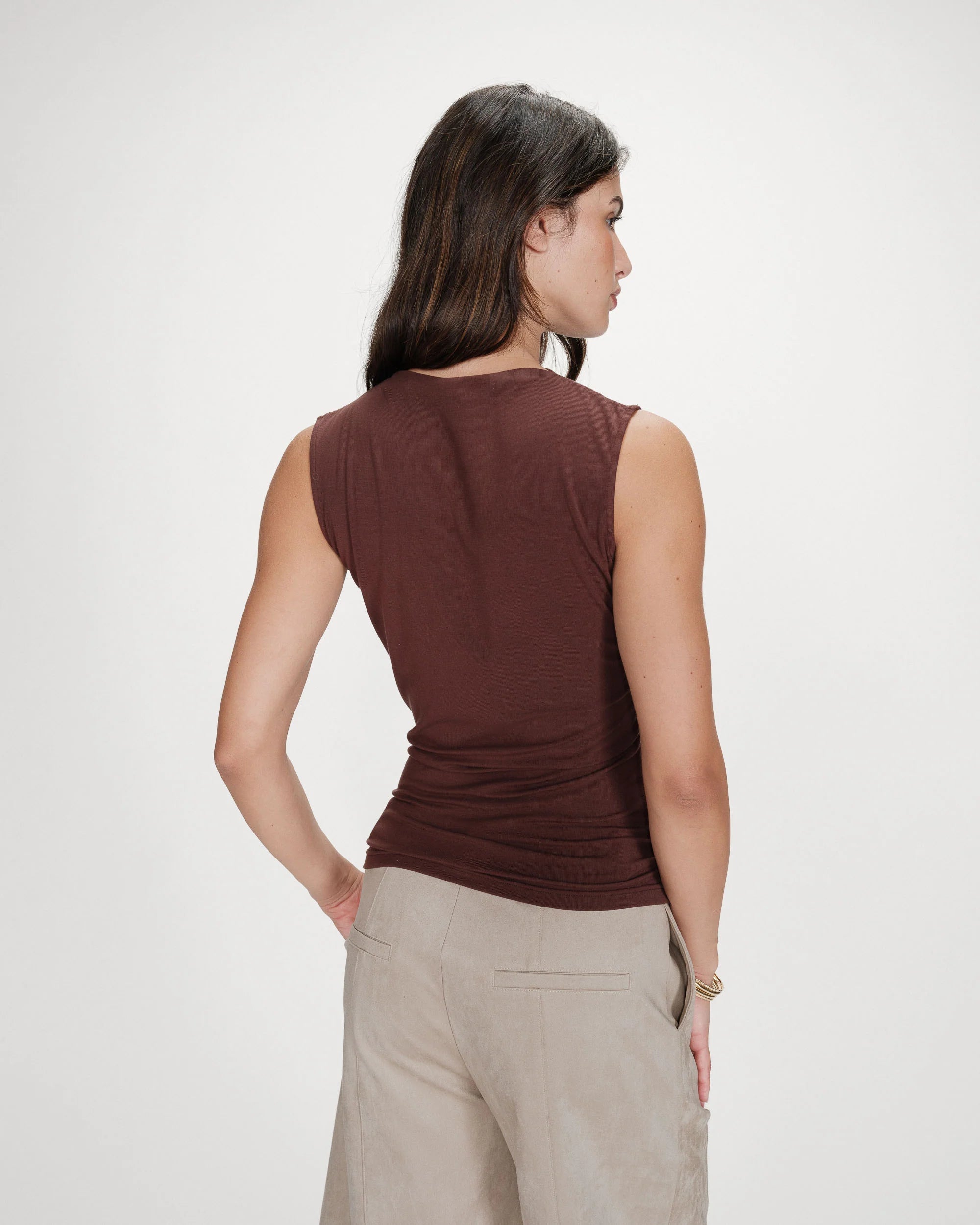 mock neck sleeveless top in brown with synching at the waist