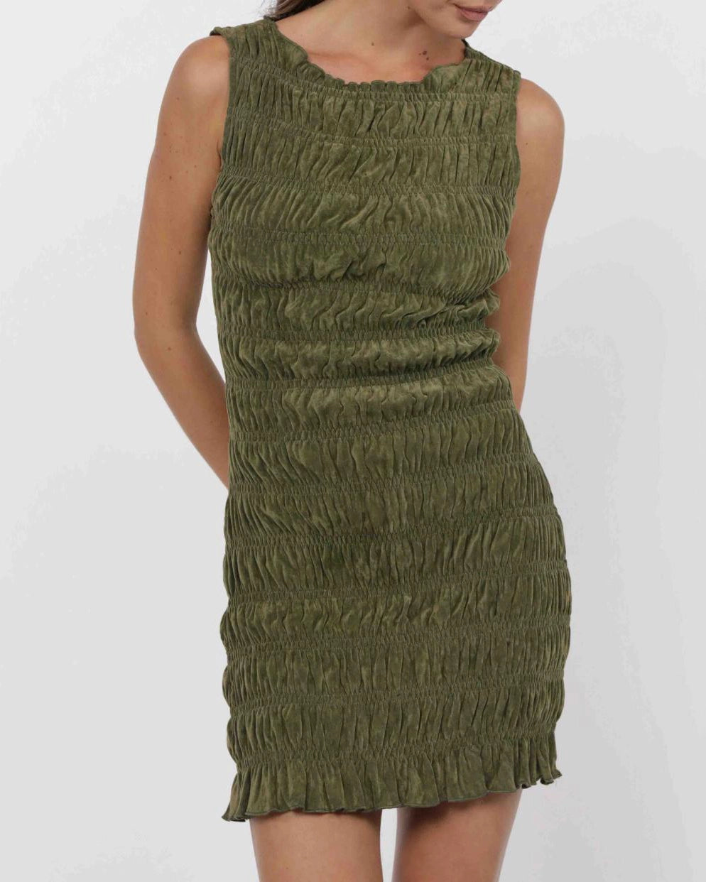 Green smocked dress on a white background