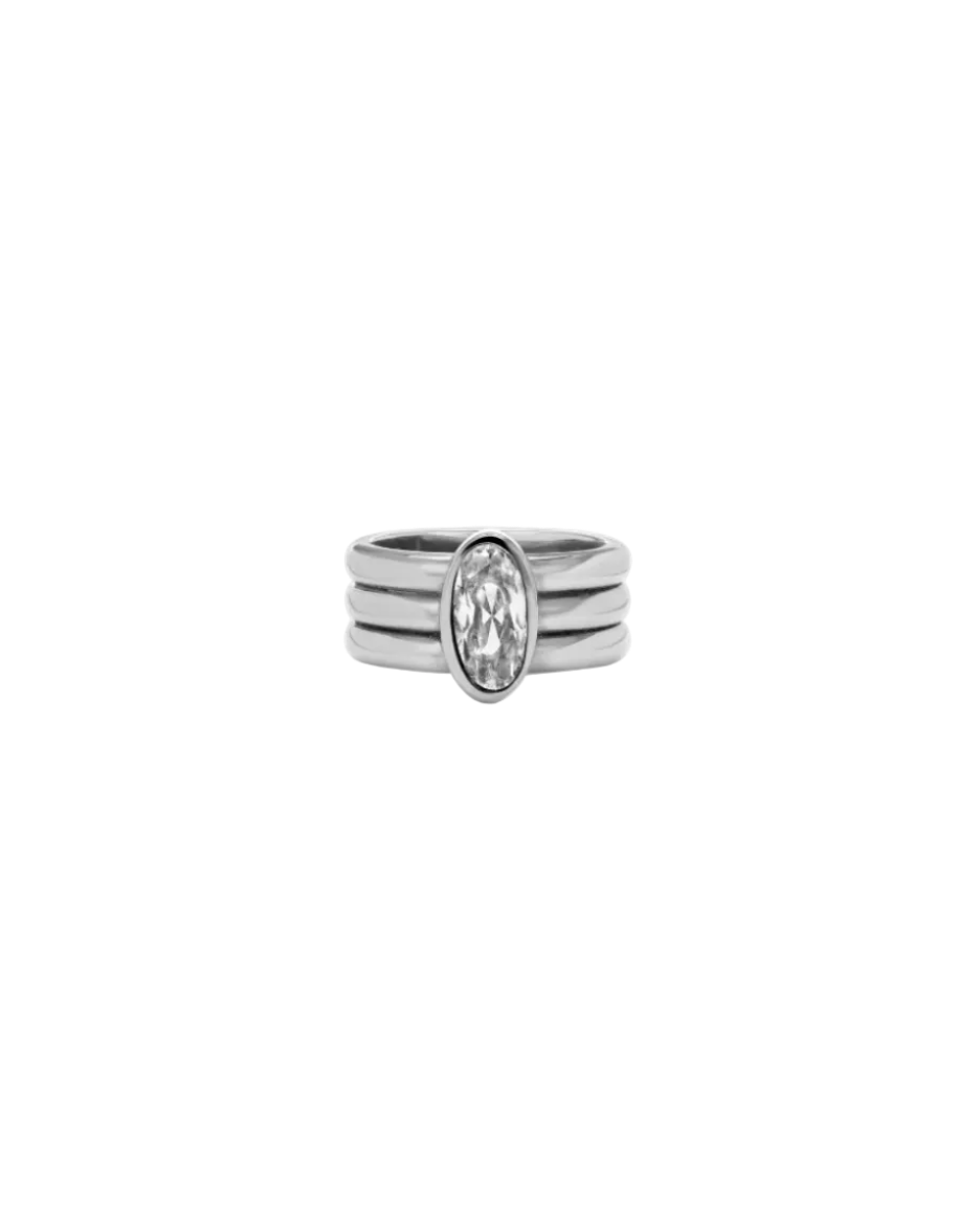 pink ring with three silver bands and oval diamond