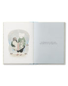 Open book with illustration of a person reading a book inside a glass bubble, on a white background.