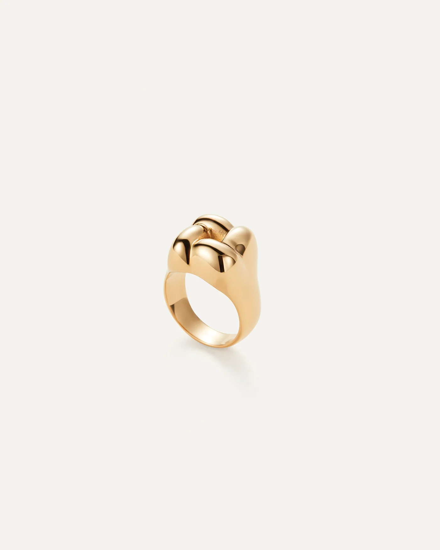 statement gold ring with a woven design on top