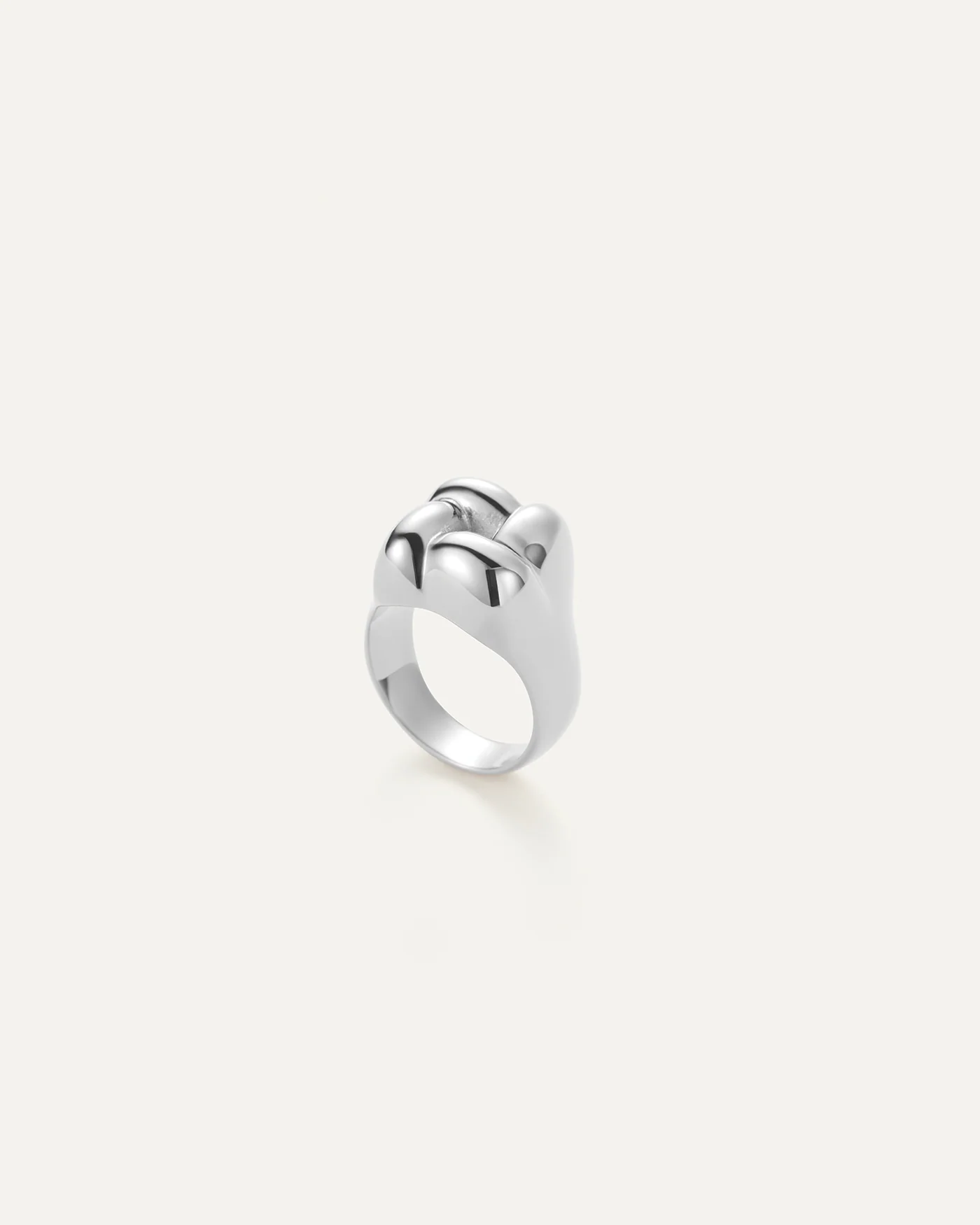 silver statement ring with a woven design on the top