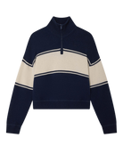 Woman wearing a navy and white striped cashmere sweater with quarter zip