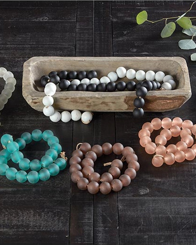 a picture of decorative beads in black glass or white glass