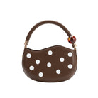 Brown handbag with white polka dots 