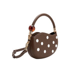 Brown handbag with white polka dots 
