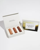 Three small perfume testers in an open box with 'Golden Hour' on them