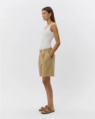 a tailored beige short that are knee length