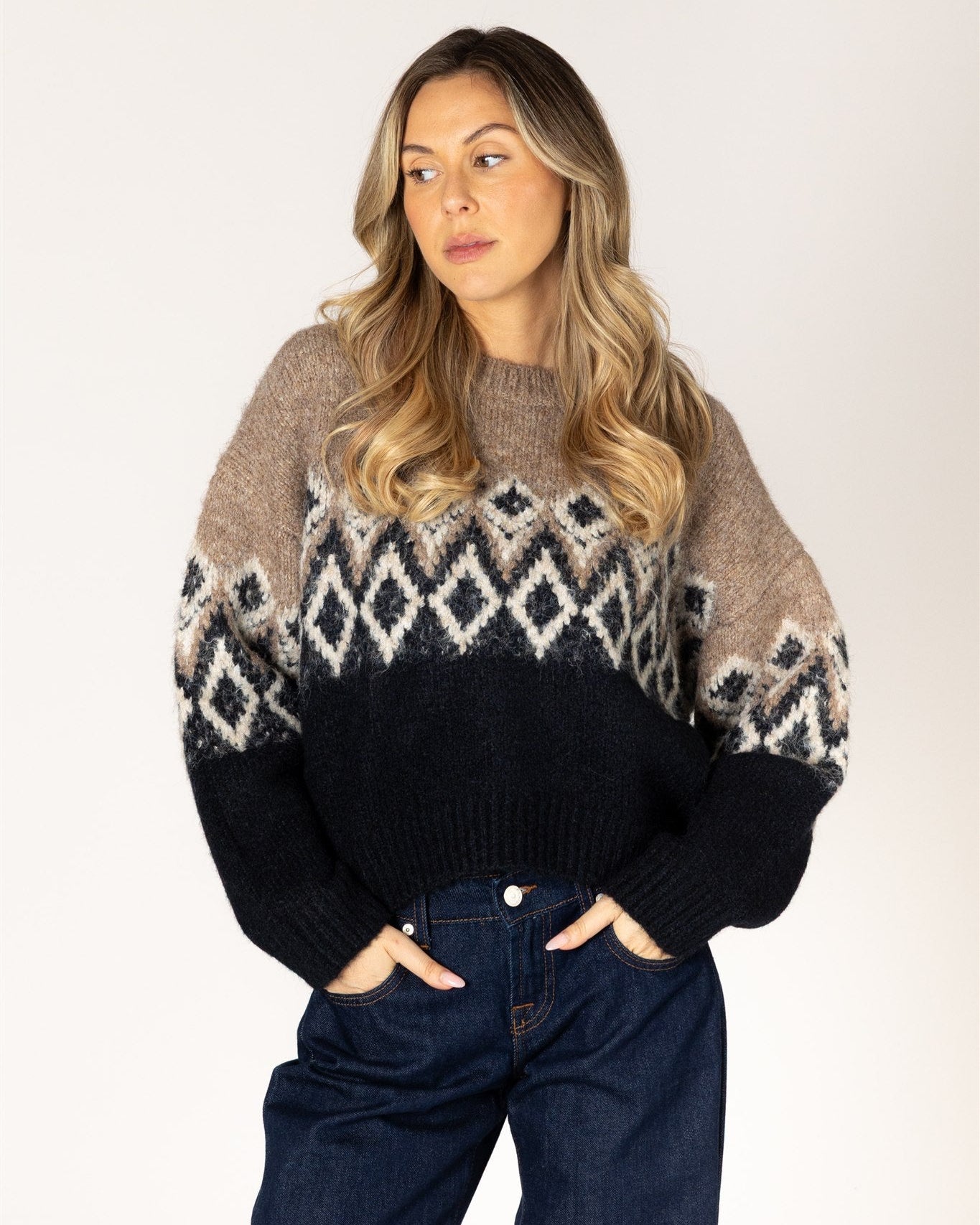 fairisle knit sweater in brown on the top and black on the bottom