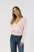 pink wrap sweater with pearls 