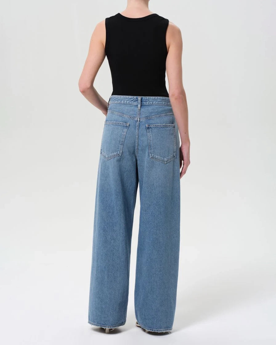 a woman wearing foldover wide leg jeans by Agolde