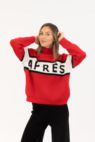 red sweater with whit and black stripe saying apres