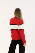red sweater with whit and black stripe saying apres