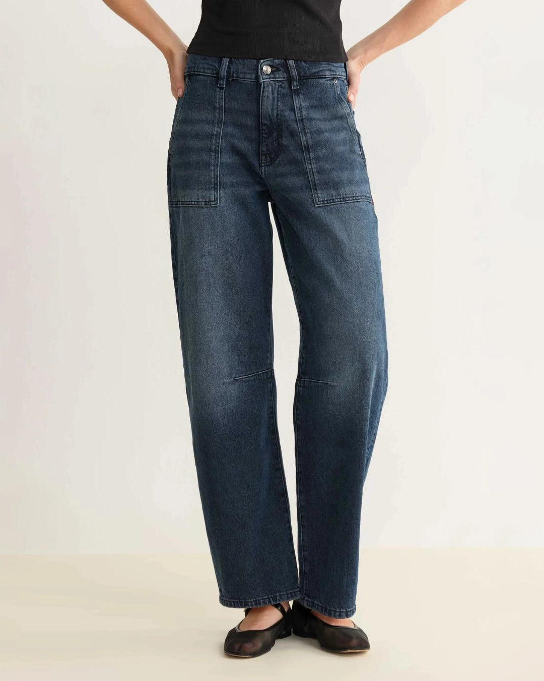 a pair of barrel cut blue jeans 