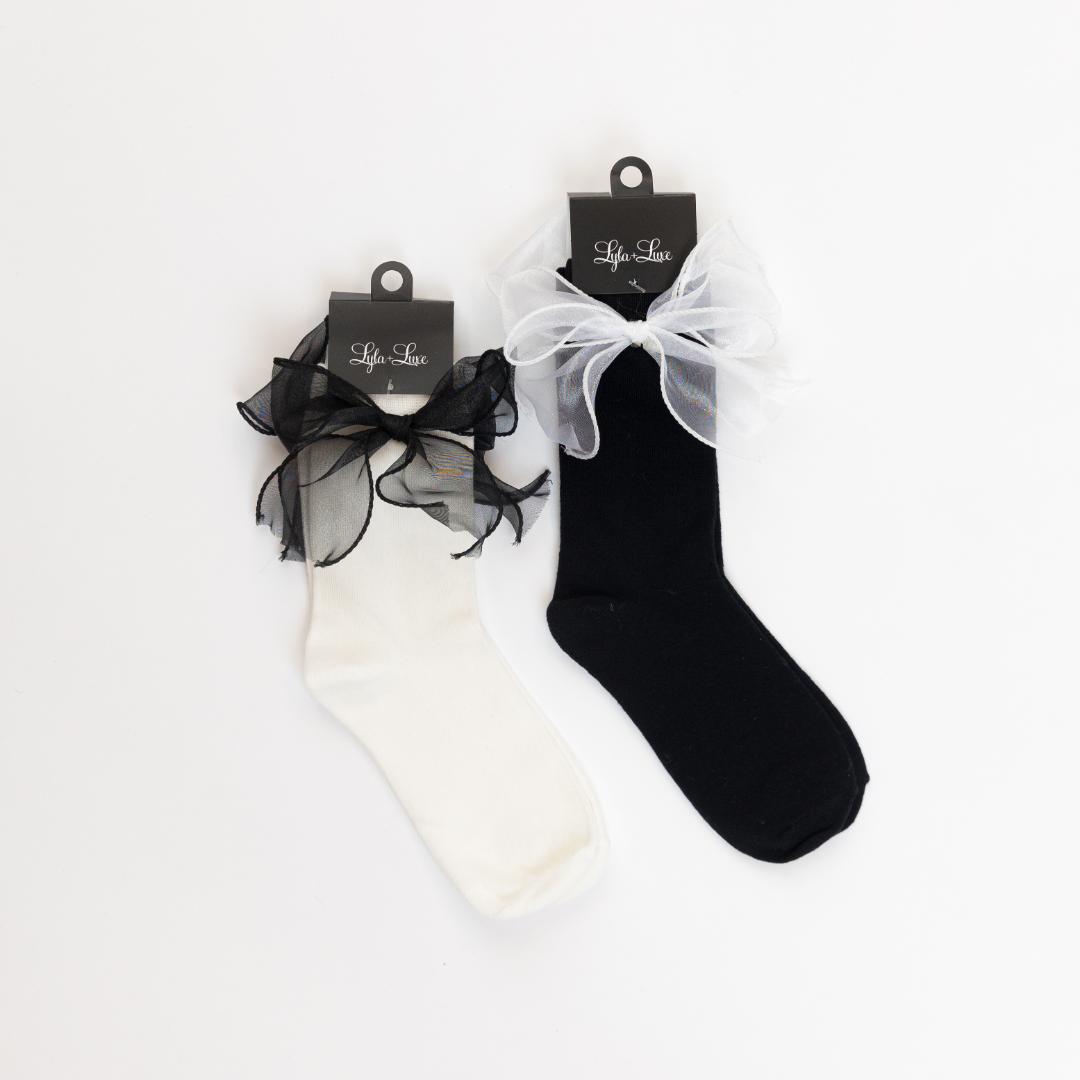 black and white socks with a satin bow on the side