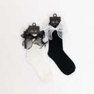 black and white socks with a satin bow on the side