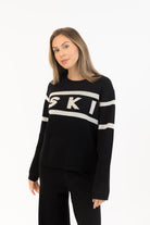 black sweater with ski written on the middle