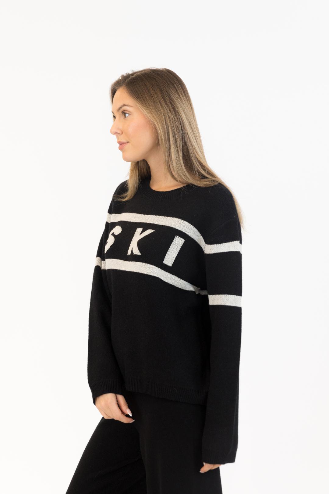 black sweater with ski written on the middle