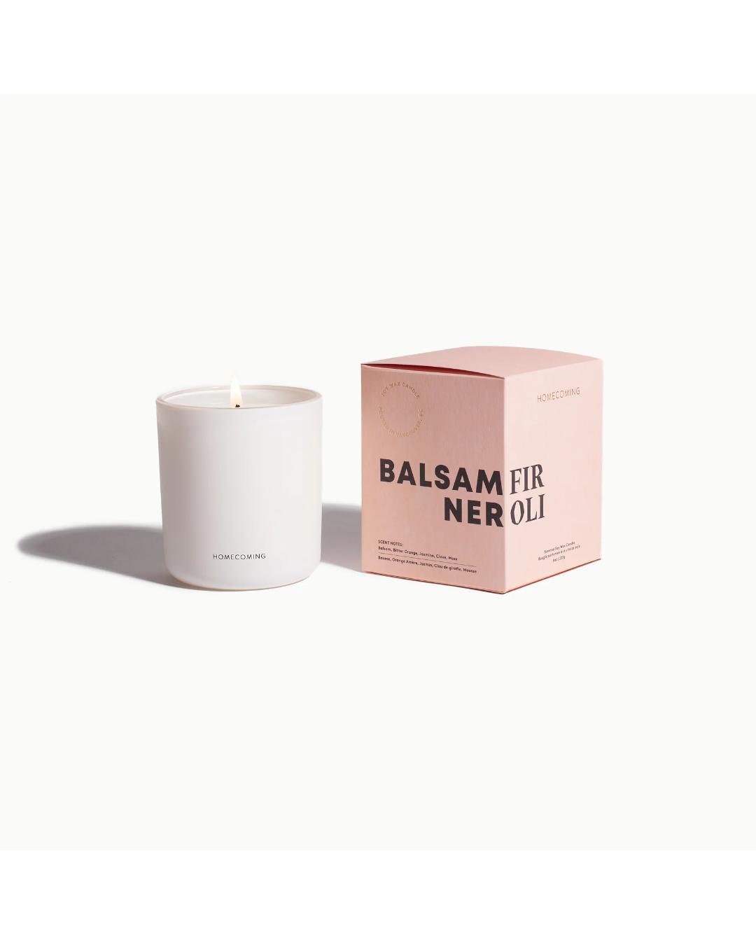 white candle that comes in a pink box
