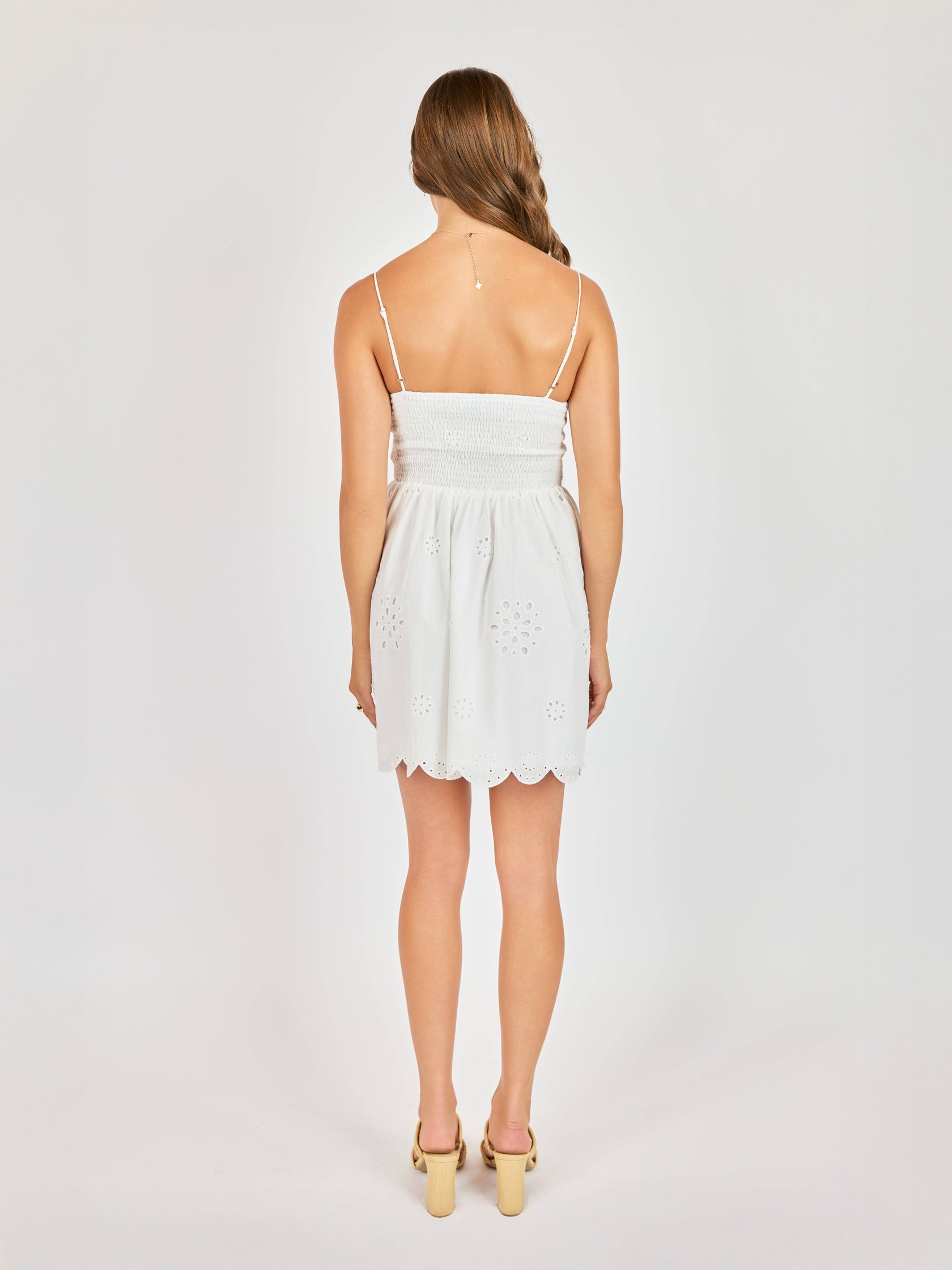 Mini white dress with an eyelet design