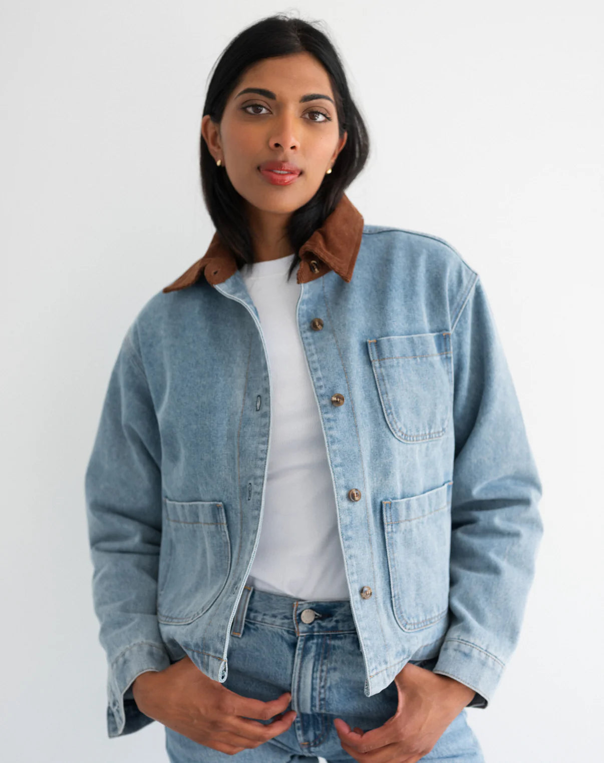 woman wearing denim jacket with brown corduroy collar