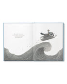 Page of Children's Book called 'Chasing Dreams: how to add more daring to your doing' by Kobi Yamada with a raccoon surfing in the ocean