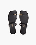 black sandal with gold toe piece 