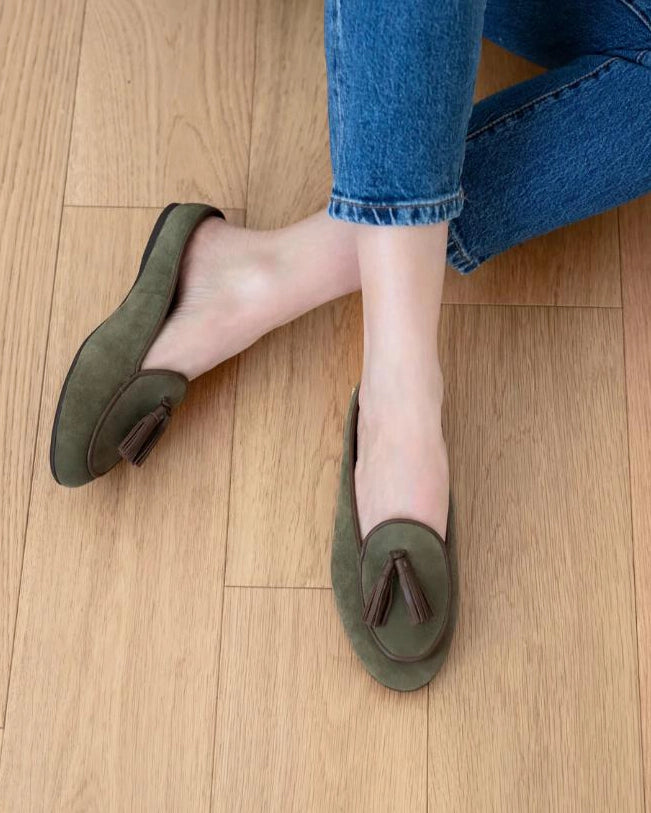 green slipper shoe with brown tassels