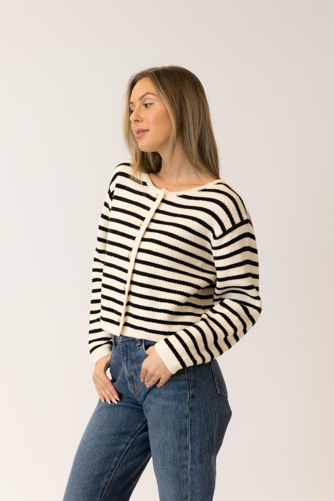 sideview of a black and white striped cardigan